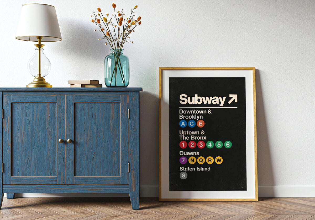Seen above the room furniture, the portrait-format Vintage Subway Wayfinding Poster print adds a distinct vertical accent.