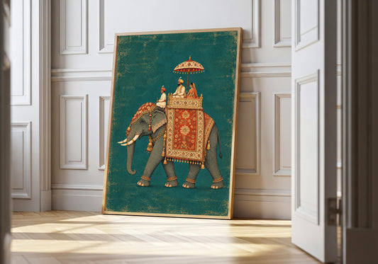 Royal elephant wall art in a light wood frame leans against white panelling, its teal background contrasting with red and gold-toned ceremonial details.