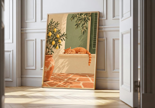 A ginger cat sleeps beneath lemon branches in a courtyard print leaning against a white panelled wall.