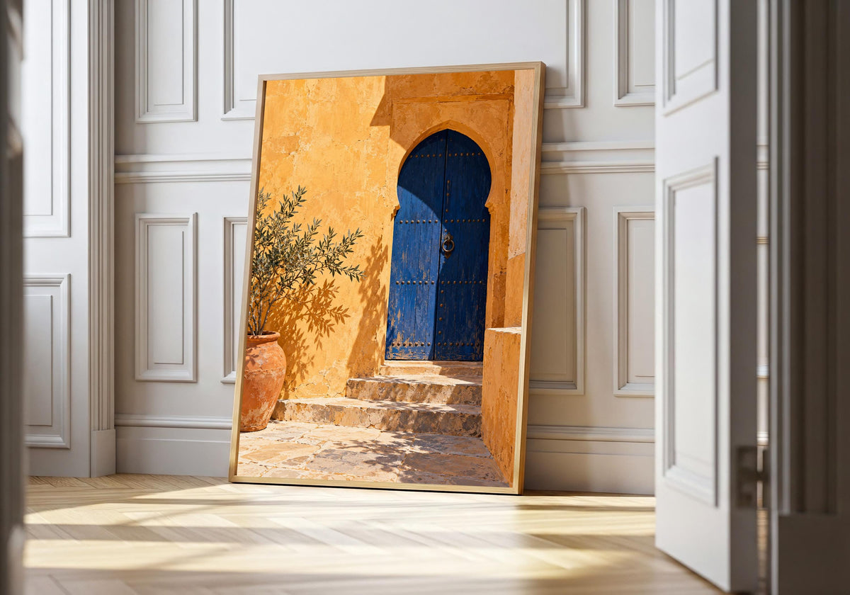 Arched blue courtyard door and olive planter in the light-wood hero mock-up.
