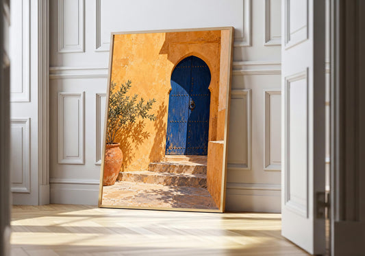 Arched blue courtyard door and olive planter in the light-wood hero mock-up.