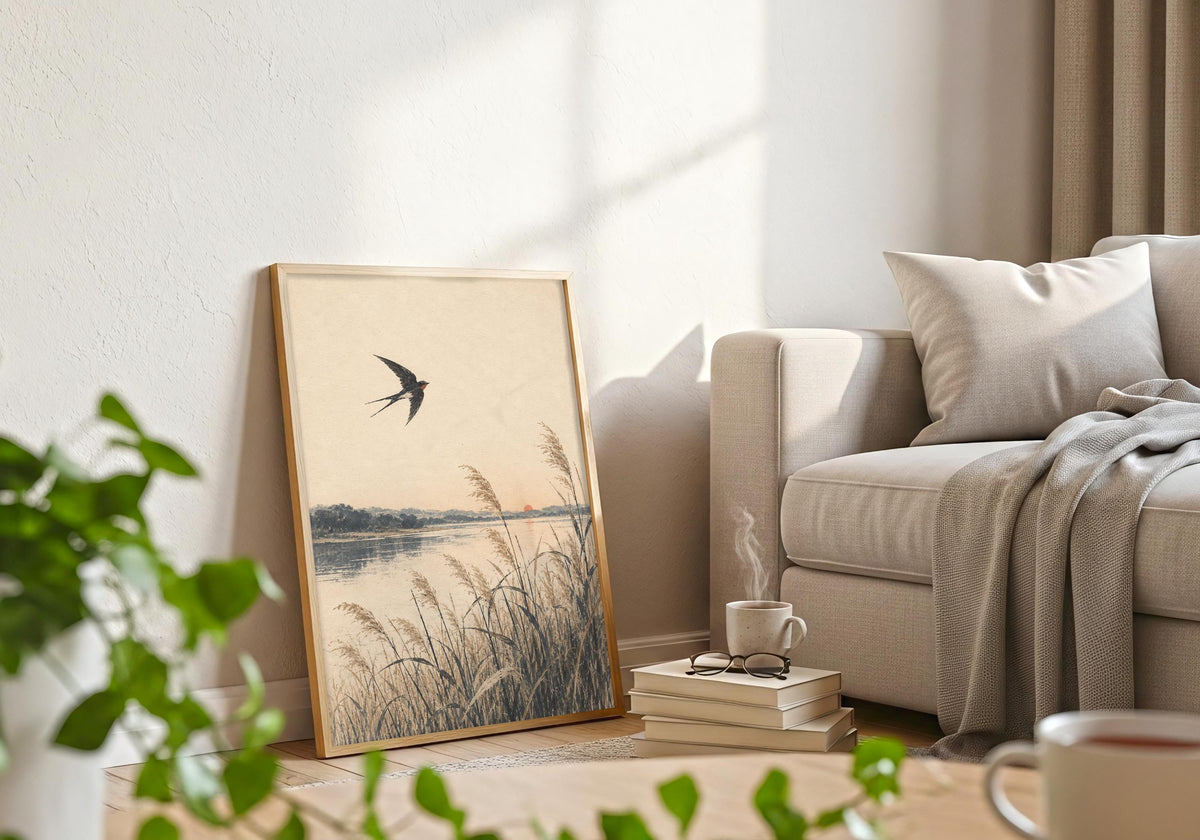 White-framed artwork shows the bird crossing above the shoreline grasses.