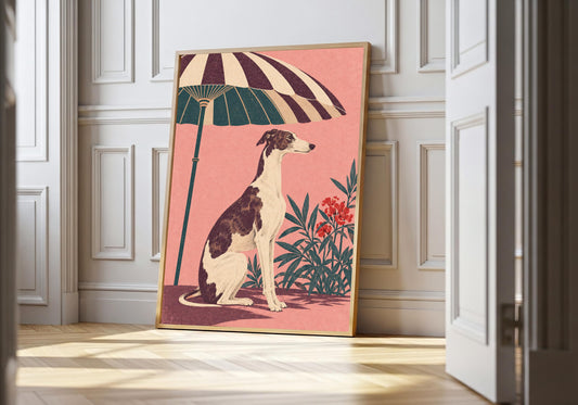 At a white doorway, a light-wood frame presents the seated whippet beneath a parasol.