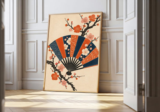 A light-wood frame at a white panelled doorway displays the indigo-and-orange folding fan.
