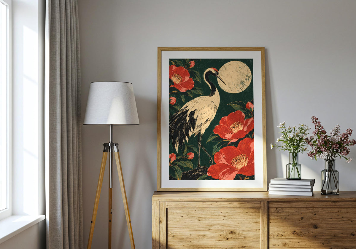 Placed above a wooden chest beside a tripod lamp, the artwork shows a pale moon above the bird.