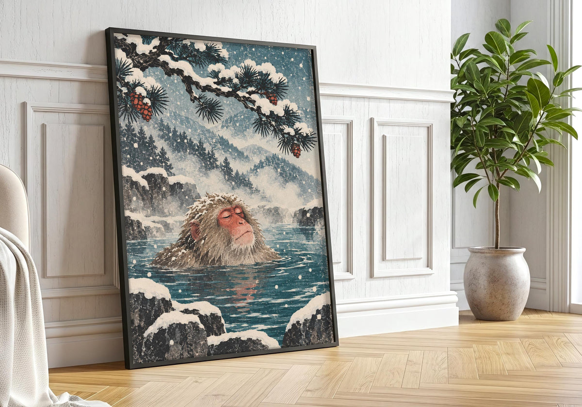This interior presents the calm snow-monkey portrait in a portrait frame against white panelling beside a large leafy tree.
