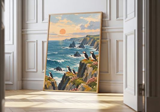 A framed view of puffins perched on coastal cliffs is displayed at a white panelled doorway.