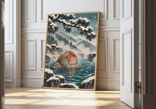 A framed view of the macaque in a snowy hot spring is displayed at a white doorway.