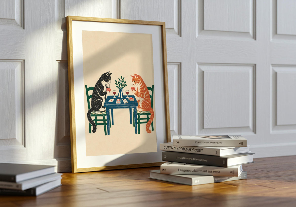 Seen above the room furniture, the portrait-format Tuxedo and Tabby Card Game print adds a distinct vertical accent.