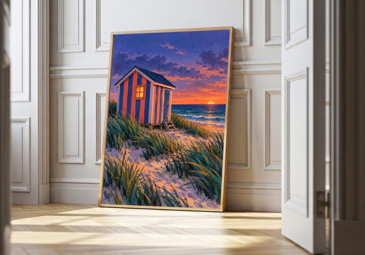 A light wood hero frame presents striped changing hut at dusk as beach hut art print in a clean interior.