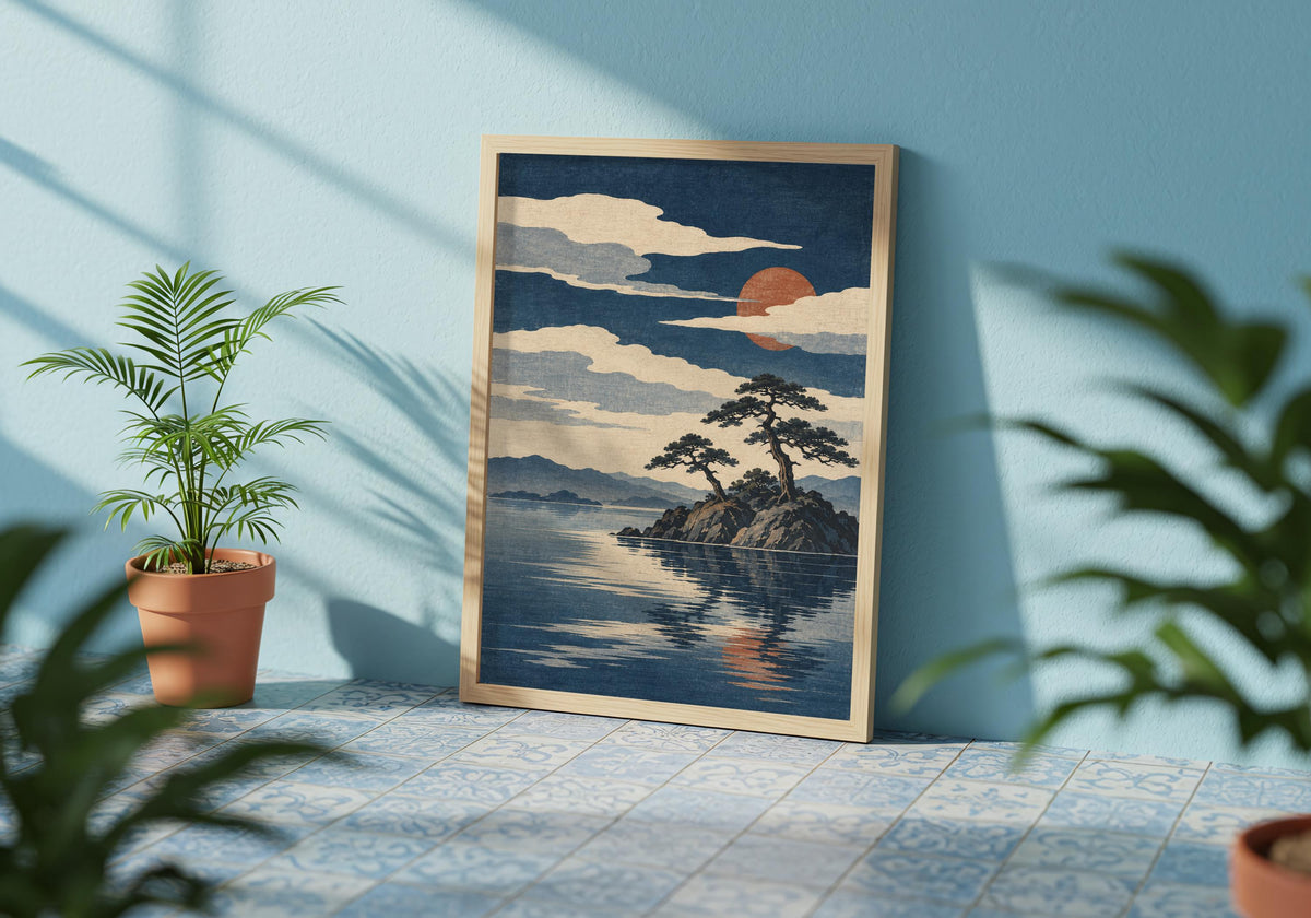 Armchair corner displays the blue lake art above a quiet reading seat.