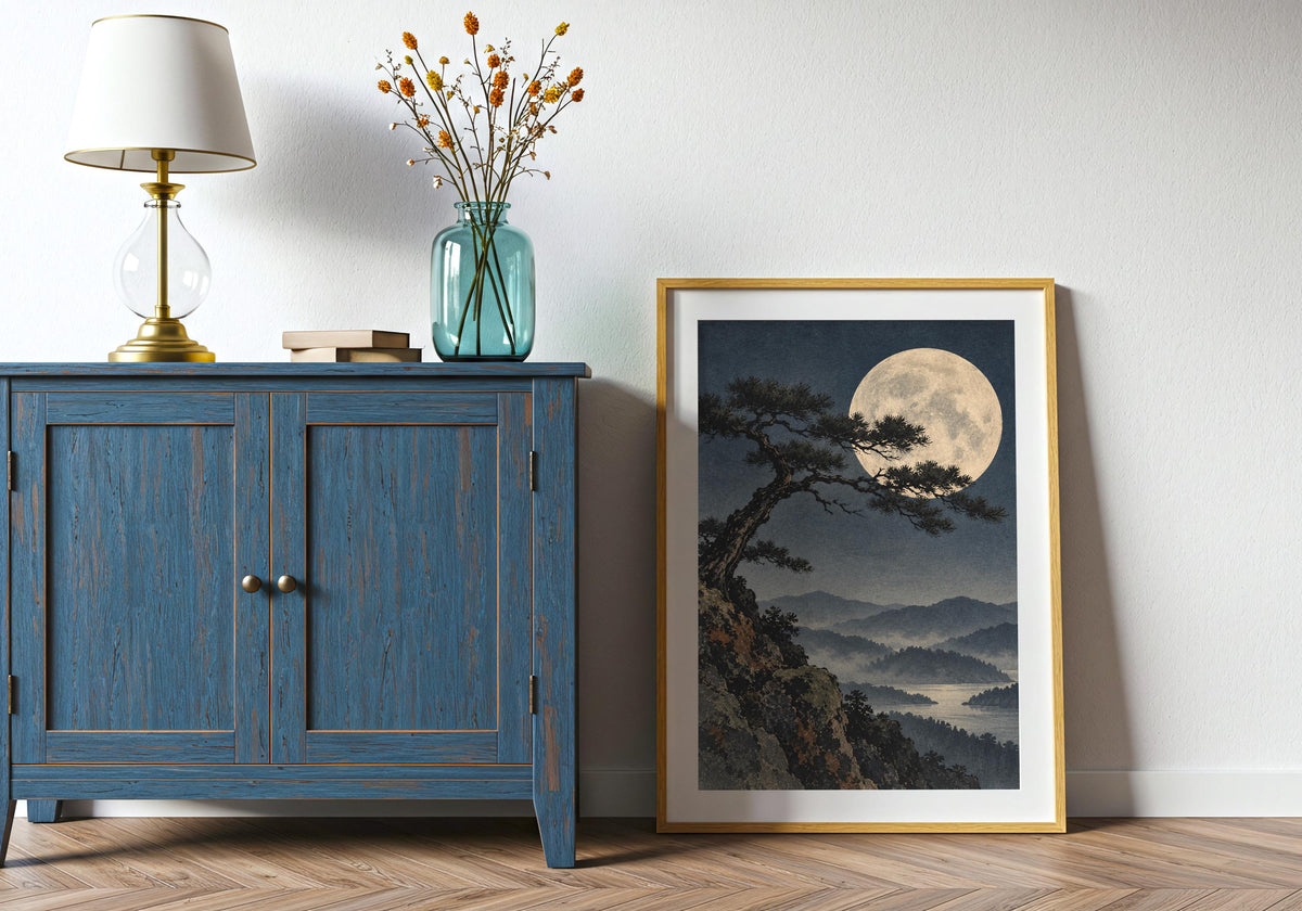 Home-office wall view features the moon and pine artwork in portrait orientation.