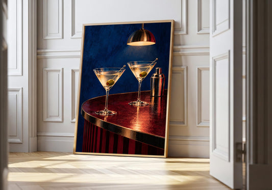 Two martinis with green olives on a burgundy bar under a brass pendant in the hero frame.