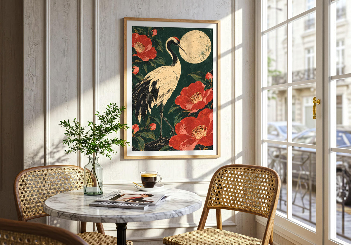 An interior view displays the pale moon and dark foliage on the wall beside a round marble dining table.