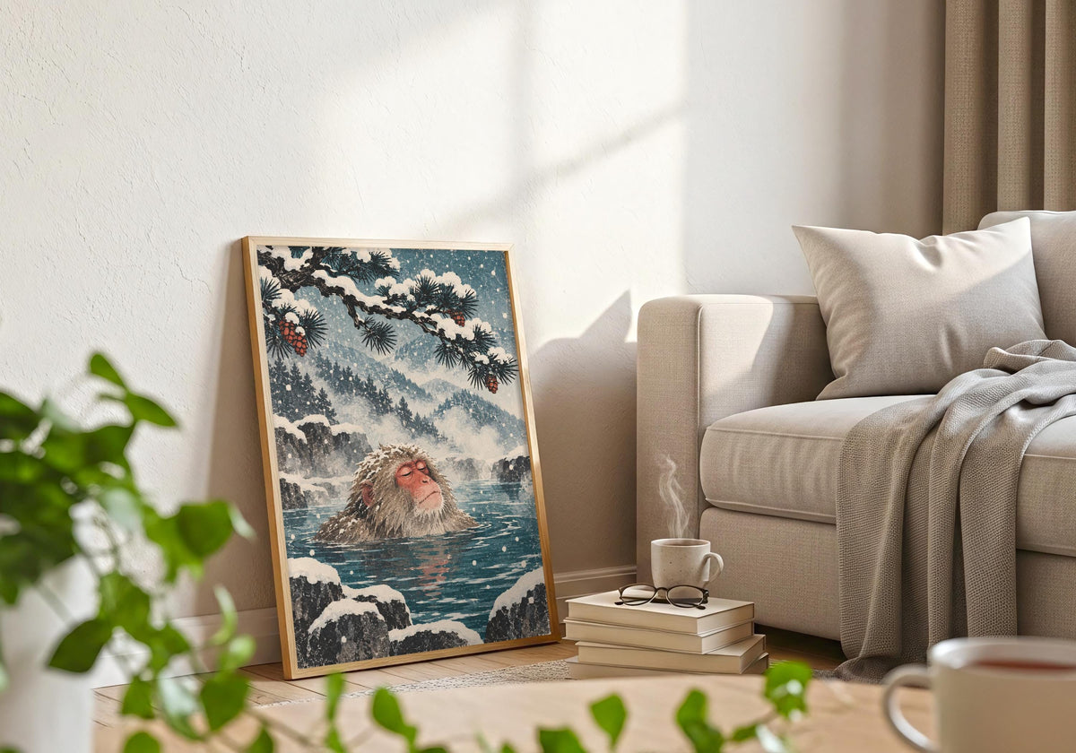The styling pairs the macaque resting in the water with a frame beside a pale sofa, books and foreground greenery.