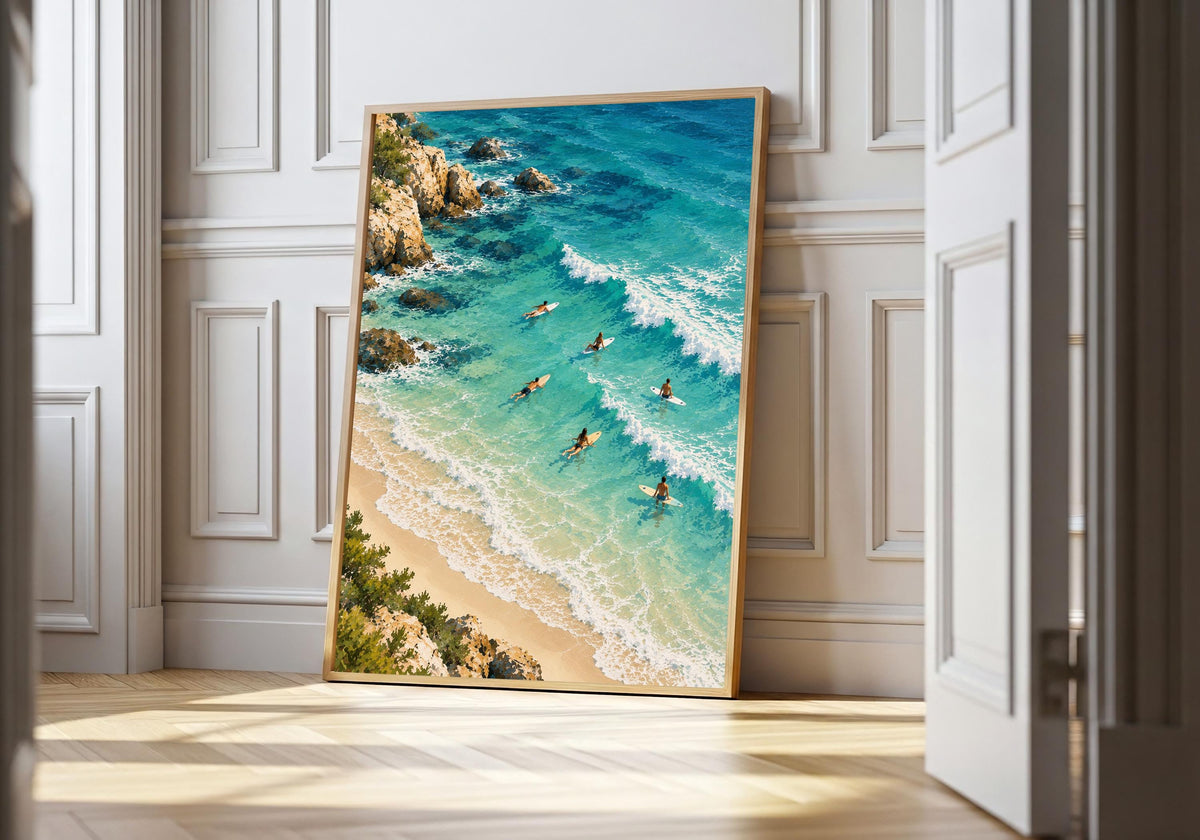 A framed view of the aerial Mediterranean-inspired shoreline is displayed at a white doorway.
